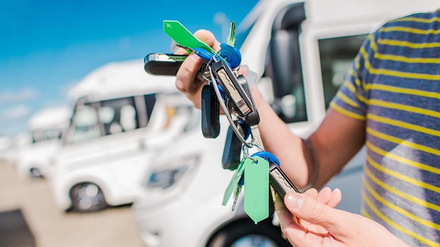 Parking lot of recreation vehicles for sale seen before performing RV inspection services 