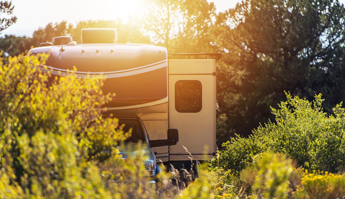 Modern motorhome parked in the first camping after thorough RV Inspection Services 