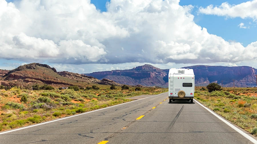 Motorhome driving on the open road after passing thorough RV inspection services 